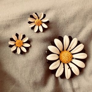 Daisy clip earrings and a brooch